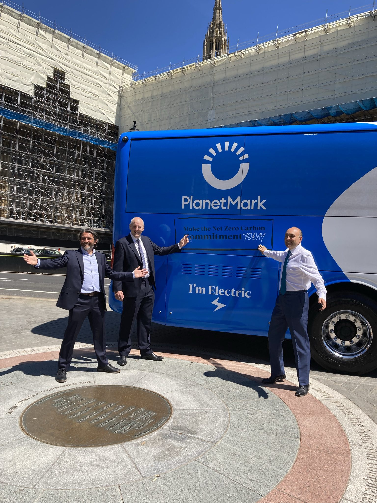 PlanetMark Carbon Tour bus outside the Houses of Parliament